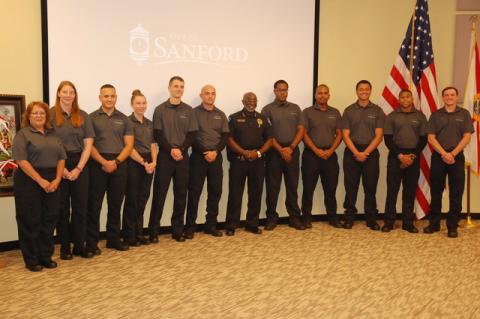 New and future police officers for the Sanford Police Department were introduced by Sanford Police Chief Cecil Smith, center, Monday night at the Sanford City Commission meeting. Smith said the group includes six officers who would be sworn in during a separate ceremony Tuesday, three cadets who will enter the police academy and a 16-week in house training, and two new community service officers. The three cadets should be on the streets by March 2022. Smith told the Herald that before this new group of rec
