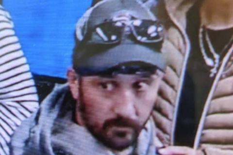 Security footage shows Marc Muffley (above) wheeling his suitcase with explosives through the Allentown, Penn. airport.