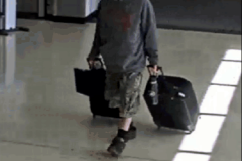 Security footage shows Marc Muffley (above) wheeling his suitcase with explosives through the Allentown, Penn. airport.