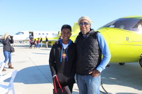 Andre Walker and his son, Andre Walker II, visited the Aviation Day event to learn more about planes and aerospace science, which Andre II is studying in school.