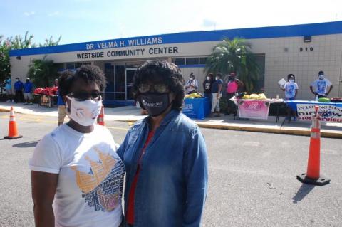 Patrice Anderson (left) and Dr. Velma Williams during the backpack giveaway this Saturday. 