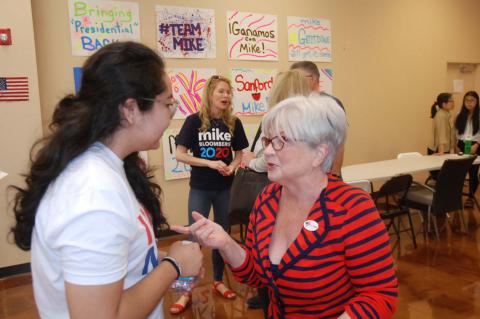 DeLand resident and Mike Bloomberg supporter Karen Finstad, right, talks politics with Sofia Garduno, regional organizing director for the Sanford field office of the Bloomberg campaign.