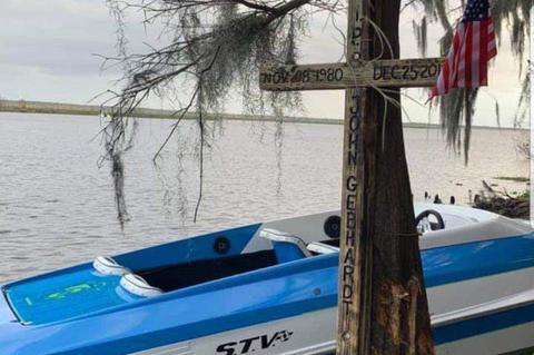A memorial in the form of a cross was placed on the tree that John E. Gebhardt hit Christmas day with his speed boat. He died on scene from the injuries.