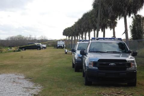 Florida Fish and Wildlife Conservation Commission vehicles line up along the Lake Jesup boat ramp in Sanford during the search for a missing boater last week. 