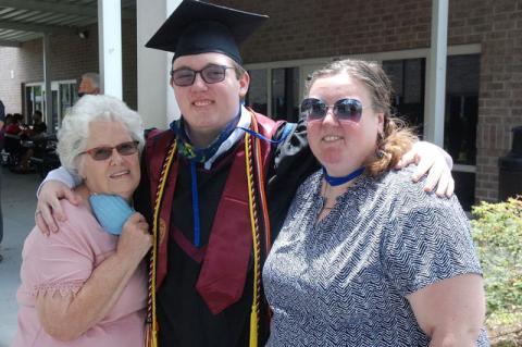 Graduate Corey Creech (center) and his family at the graduation. 