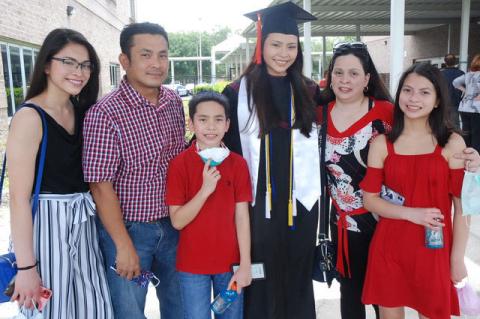 The Crisostomo family with graduate Qrizten. Two of Qrizten’s sibilings also attend Crooms Academy of Information Technology. 