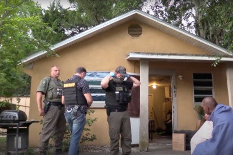 Sheriff’s deputies during one of the resulting raids from a six-month investigation. 