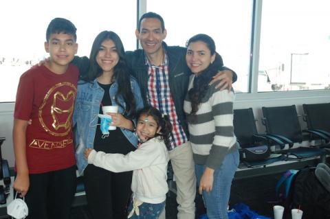 The Buarte family from Hamilton, Ontario, were among the first Swoop airlines passengers to arrive in Sanford on Saturday morning.