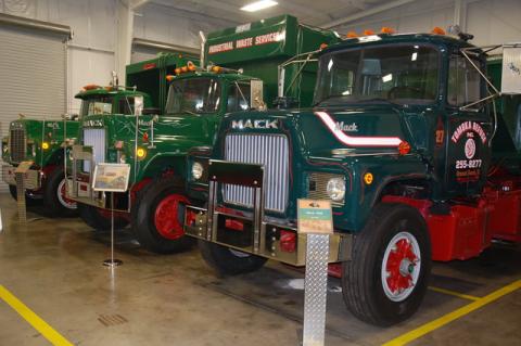 Three Mack trucks with the rare gold bulldog hood ornament meaning they had Mack engines, axles and rear ends. The trucks on part of a large collection at the Waste Pro Gabage Truck Museum.
