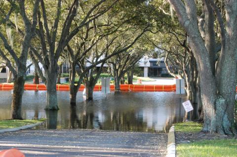 Rising waters in front of the HCA Florida Lake Monroe Hospital forced the northern entrance to close to traffic.
