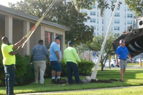 Crews remove the canon, which also contains a flag pole, from out front of the former Greater Regional Chamber of Cemmerce in downtown Sanford. The canon was moved to the Sanford Museum. 