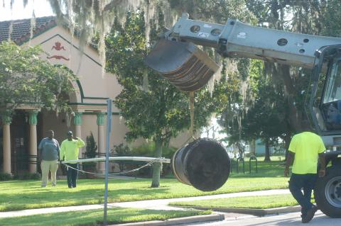 City of Sanford crews move the old canon down the street from the old Sanford of Commerce to the Sanford Museum. 