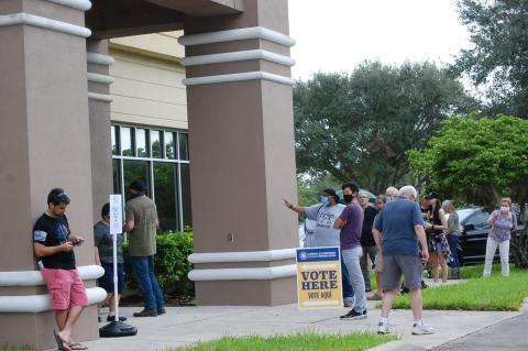 Voters line up at the Supervisor of Elections Office in Sanford for early voting.
