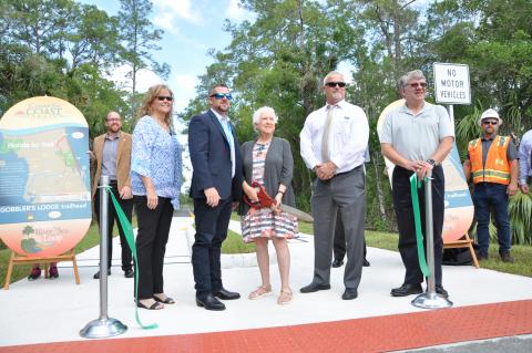 Officials celebrate the completion of the East Central Regional Rail Trail connecting Volusia and Brevard counties. 