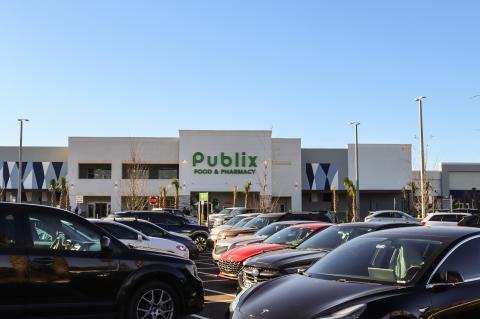 The Publix at King’s Crossing (above) opened Thursday morning with employees welcoming (below) the first guests to the store.
