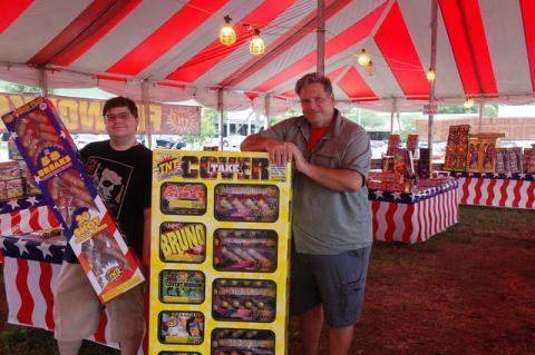 Nicholas Benko (left) and Robert Capko at First American Fireworks in the Winn-Dixie parking lot in Sanford. 