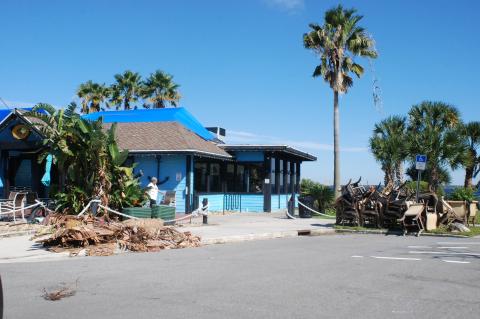 Workers at the St. Johns River Steak & Seafood clear storm debris and the contents of the restaurant this week as water finally recede around Lake Monroe.