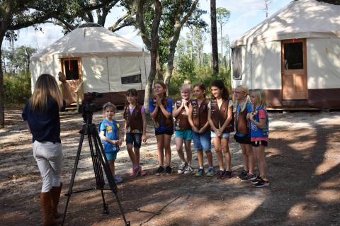 A local Girl Scout troop gathers in front of the tents at the renovated Mah-Kah-Wee camp.