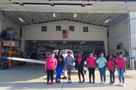 Glorious Hands girls inside the hangar in Apopka for their flight with Young Eagles.