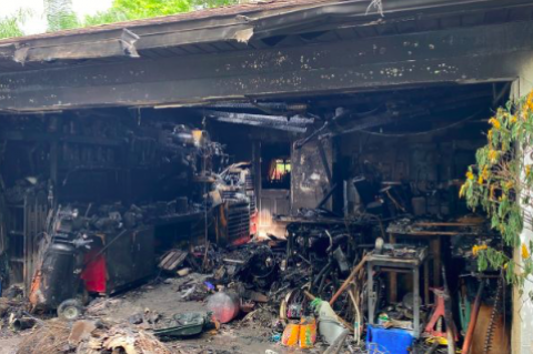 The home fire started in the garage (above) and evetually spread in the Longwood home. 