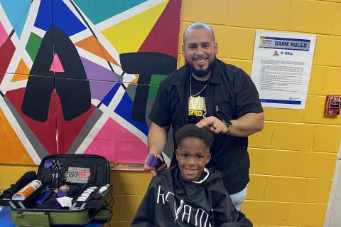 Revamp Barbershop and Ace of Fades provided free haircuts to kids at the Back to School Bash.