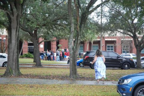 Parents gather outside of Lake Brantley High School Friday morning just before the Code Red was lifted at the Altamonte Springs school.