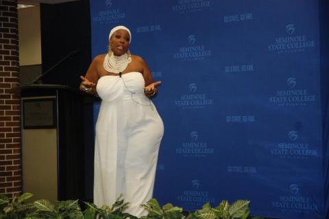 Dr. Kinitra Brooks answers questions from the audience Wednesday night during her presentation at Seminole State College.