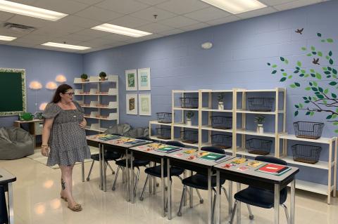 Markham Woods Middle School 6th Grade English Teacher Carol Ramsey tours her newly decorated classroom. 