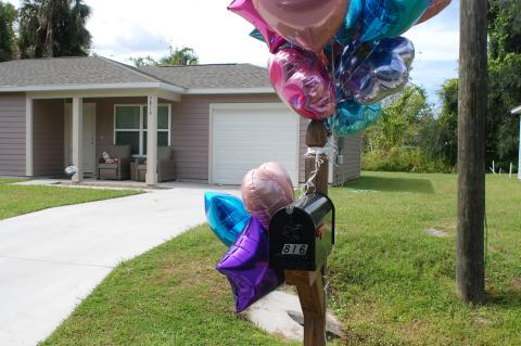 A memorial showed up outside the home on Alexander Avenue this week. 