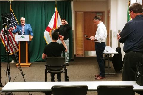 Adam Ledo and Andres Velandia (center) at a recent Seminole County press conference. 
