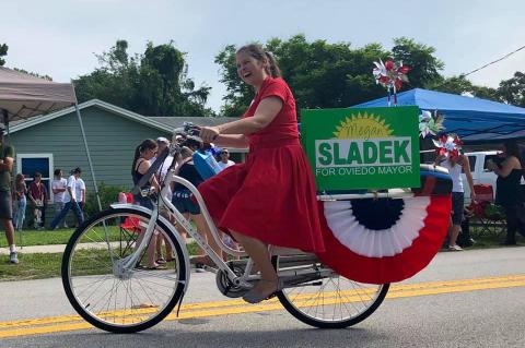 Megan Sladek, candidate for Oviedo mayor, rode a bike in the Geneva parade on the 4th of July this year.