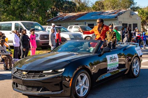 Pastor Paul P. Wright, Grand Marshal, (accompanied by Little Miss Zoë Campbell).