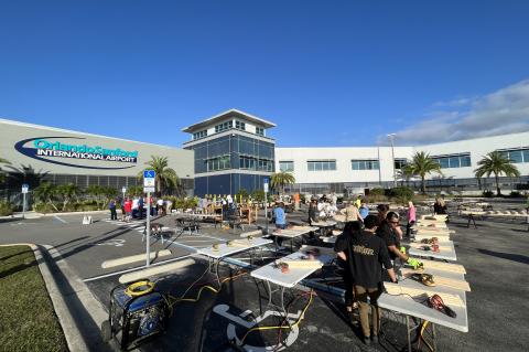 Employees from the Orlando Sanford International Airport gather together last Friday to build 40 beds from scratch for the organization Sleep in Heavenly Peace, which provides beds for children in need.