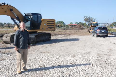 James Dunn King stands on property that he and his father bought more than two decades ago at the corner of State Road 46 and East Lake Mary Boulevard. The property is expected to house a Publix supermarket, Wawa gas station and a 261-unit apartment complex to be completed by late 2023.
