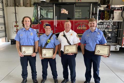Firefighters Evan Futato, Cole Mustardo, Lt. Matthew Rothfuss, and Firefighter Wesley Preedom with their awards.