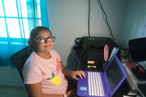 Seminole County Public School student Chelsea Moreno works on her laptop, as her parents have made decision to keep her home during what would have been her first year in middle school. 