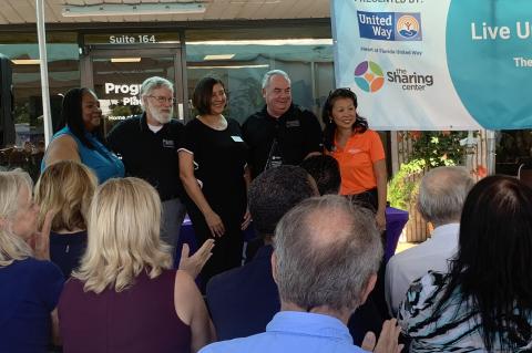 The Sharing Center team members and CEO Nina Yon (right) at the grand opening of the Live United Village on Wednesday in Longwood.