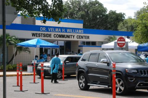 Residents drive through the pop-up testing site at the Westside Community Center in Goldsboro on Thursday.