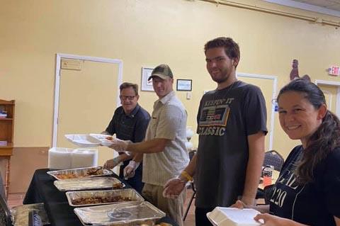 Members of the Orlando Baptist Church host a weekly food giveaway, feeding 50 homeless people. 