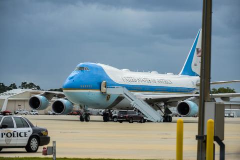 Air Force One, President Donald Trump’s plane, lands at the Orlando Sanford International Airport early Monday morning before Trump headed to a private fundraiser in Longwood.