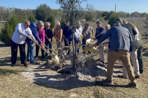 Local and state officials take part in the tree planting ceremony at the community celebration for the completion of the Wekiva Parkway that was held this past Saturday at the Neighborhood Lakes Trailhead in Lake County.